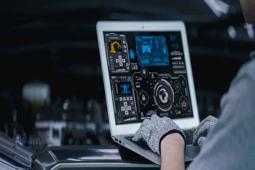 car diagnostic system in use by skilled mechanic