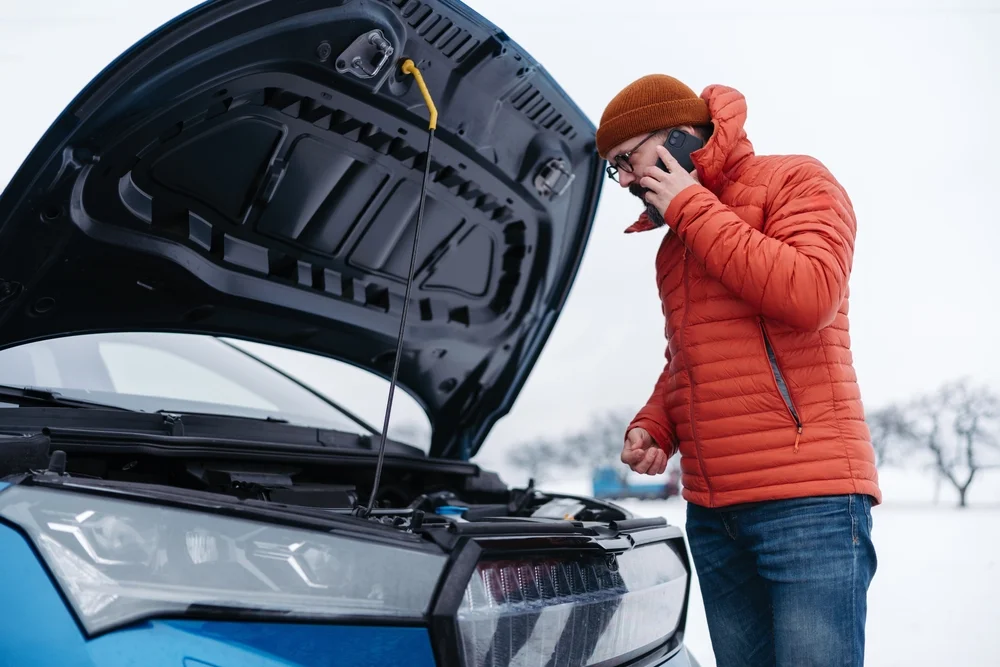 electric car brokedown on road owner calling for help