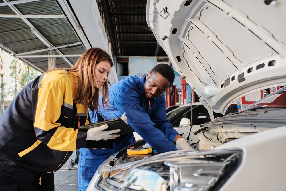 car engineers working on car care