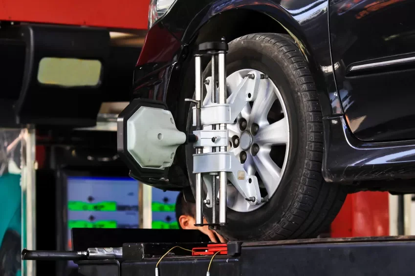 car on a wheel alignment ramp