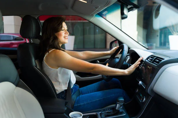 lady enjoying cool air from car ac